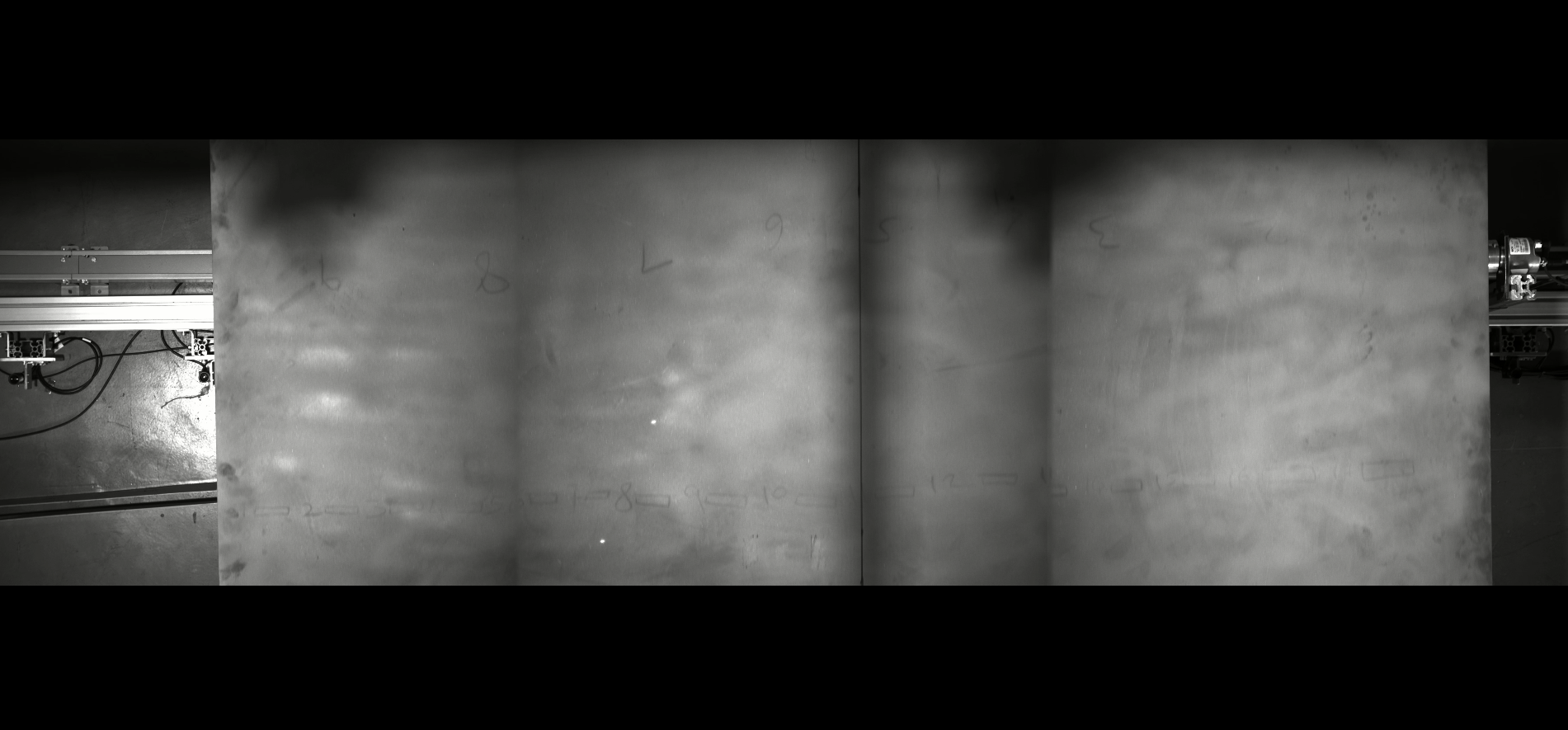 Stitched AI inspection view of a metal plate with bounding boxes around every detected defect