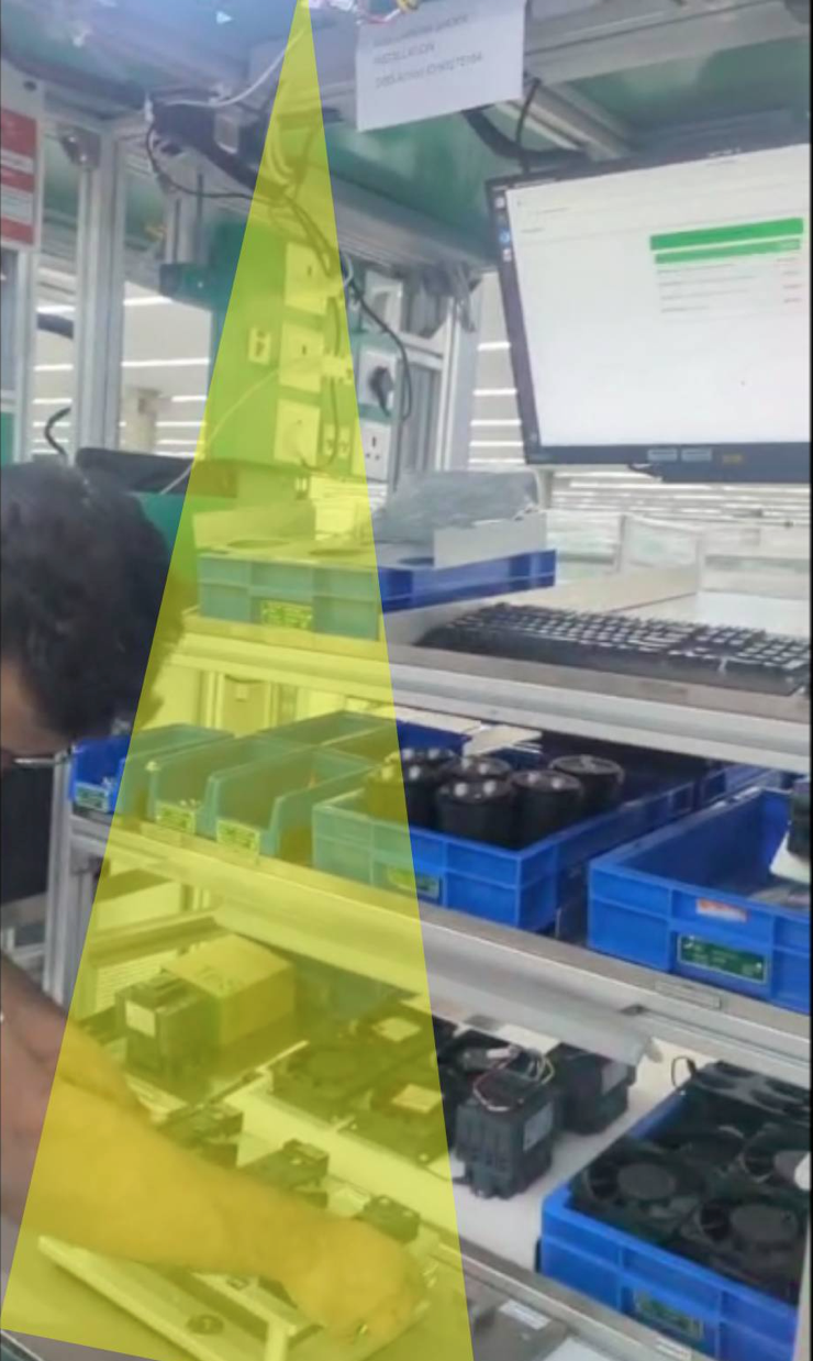 Guided assembly station with the AI vision coverage zone highlighted across all kitting bins and the build fixture